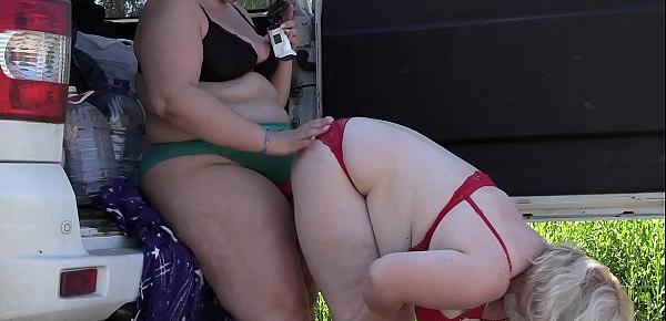  Voyeur spying on two fat lesbians who make a sex film near the car. Mature girlfriends with big asses behind the scenes. Fetish outdoors.